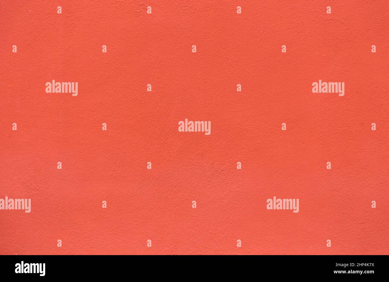 Roter Wandhintergrund gibt ein harmonisches Muster Stockfoto