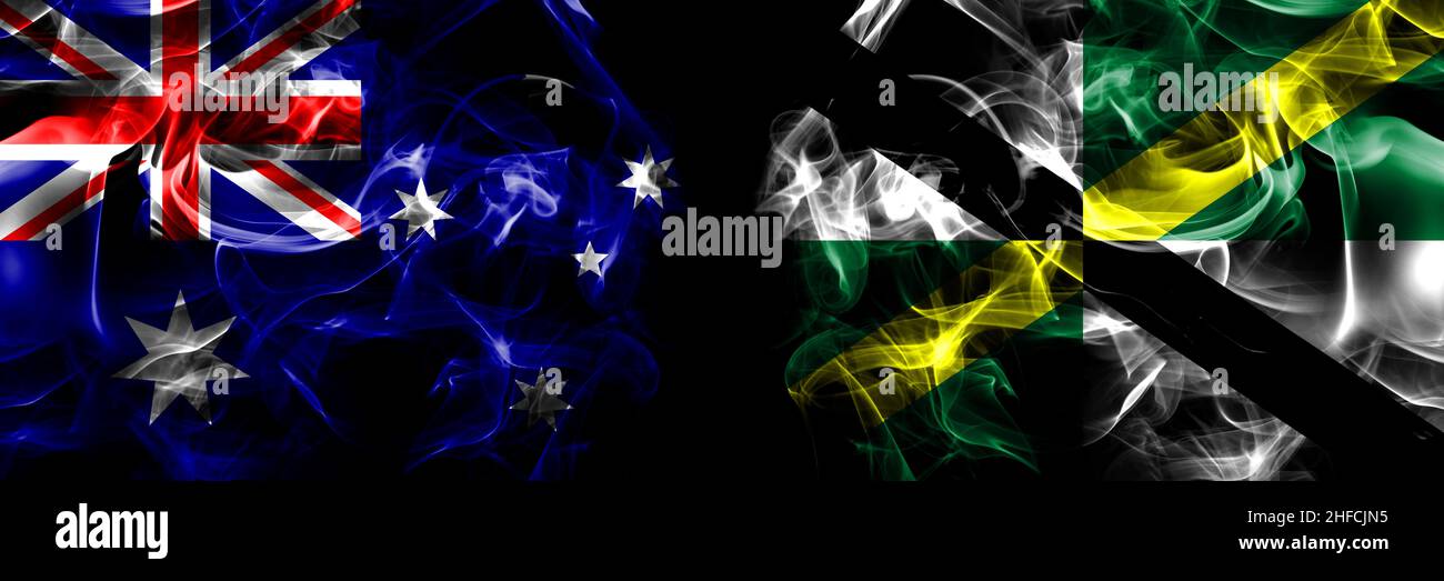 Flaggen von Australien, Australien gegen die Vereinigten Staaten von Amerika, Amerika, USA, USA, Monterey, Kalifornien. Rauchfahne nebeneinander auf Schwarz platziert Stockfoto