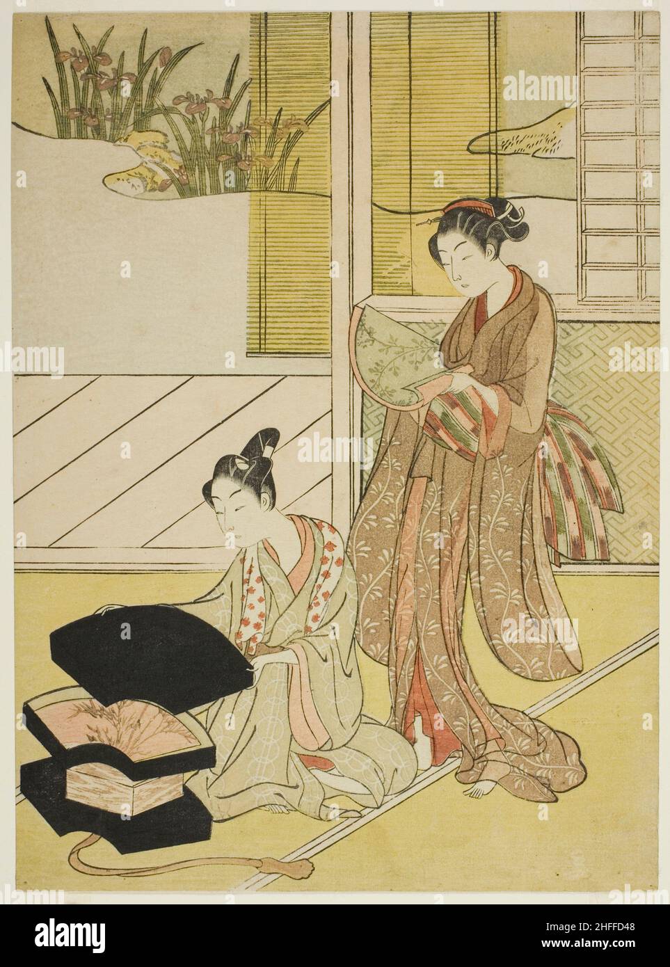 Ein Fan Peddler zeigt seine Waren einer jungen Frau, c. 1765/70. Wird Suzuki Harunobu zugeschrieben. Stockfoto
