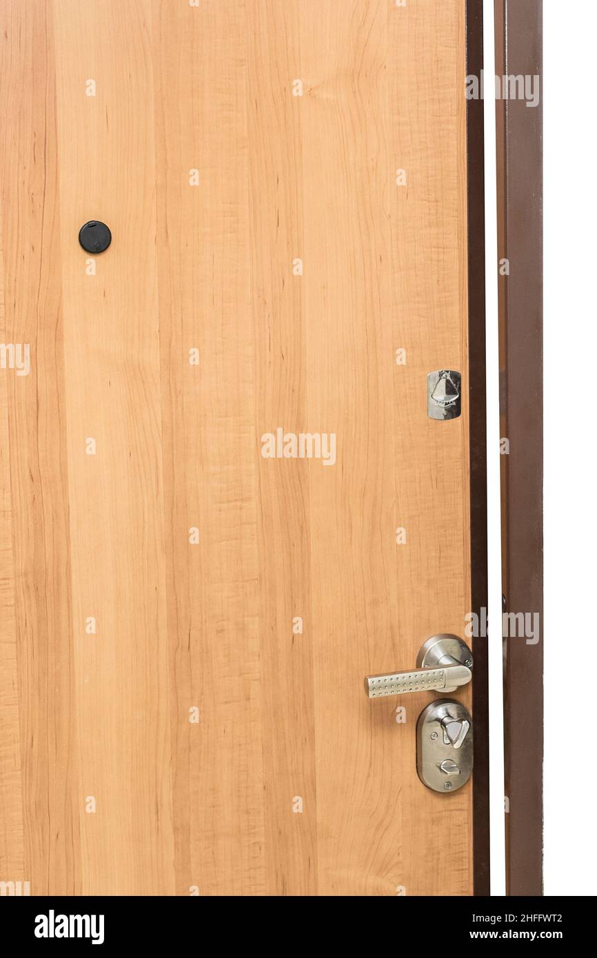 Eingang aus Holz, mit eisernem Griff, Schlüsselloch und Gußloch. Stockfoto