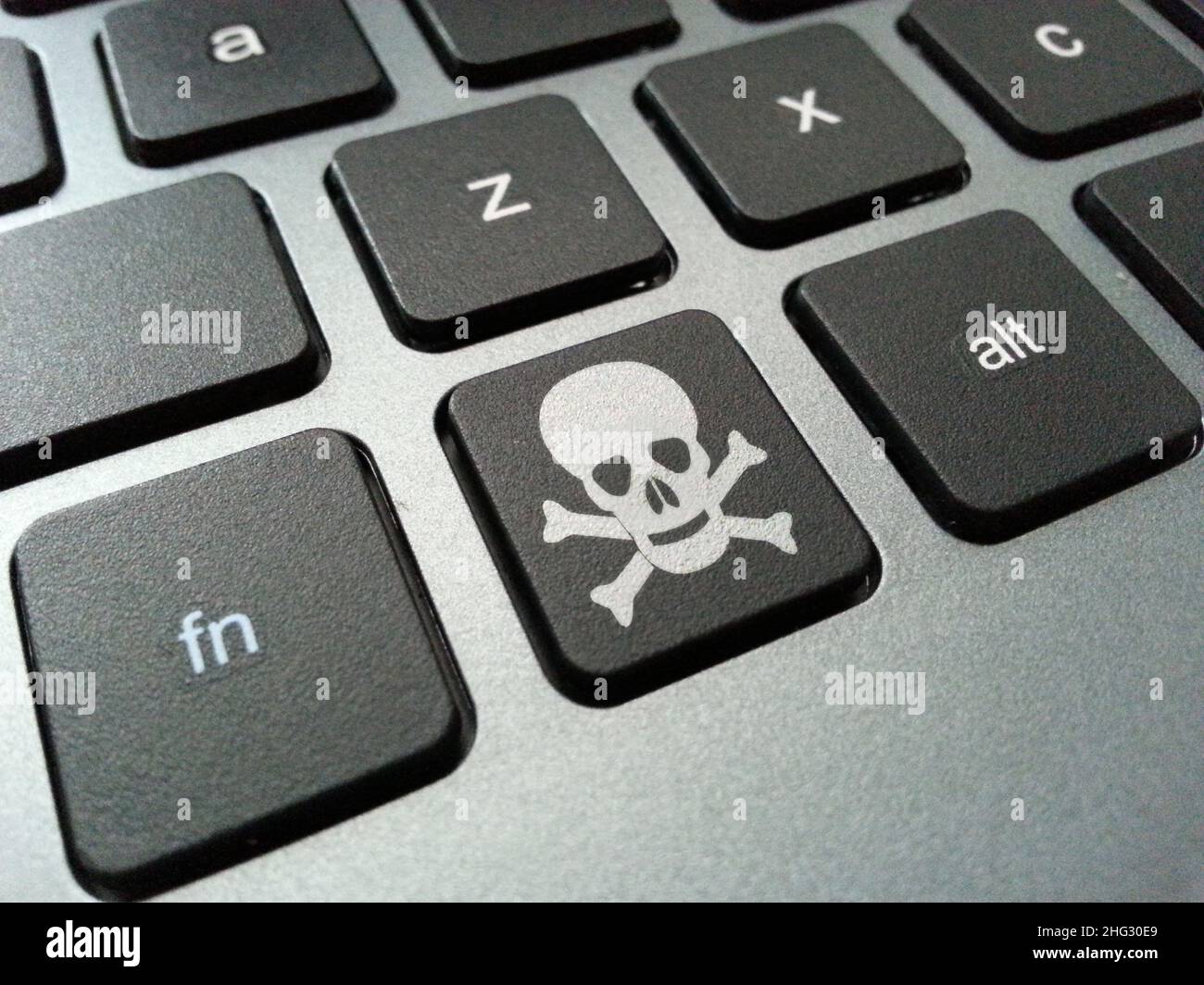 Schädel- und Crossbones-Tastatur-Taste Stockfoto