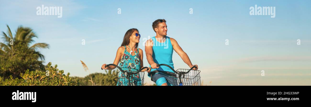 Radfahren Touristen paar Radfahren genießen Sommer Outdoor Sport Aktivität Banner Panorama. Junge Frau und Mann fahren Fahrräder auf Karibikurlaub Stockfoto