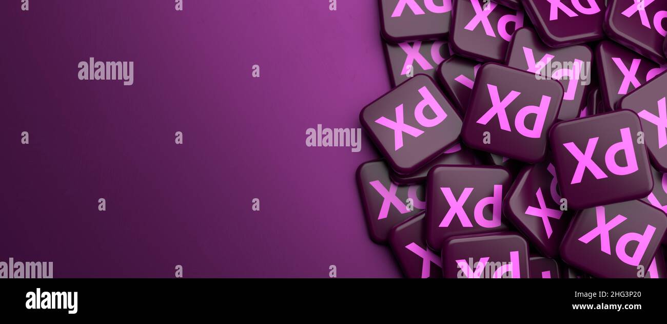 Logos des User Experience Design-Tools Adobe XD auf einem Haufen auf einem Tisch. Speicherplatz kopieren. Webbanner-Format. Stockfoto