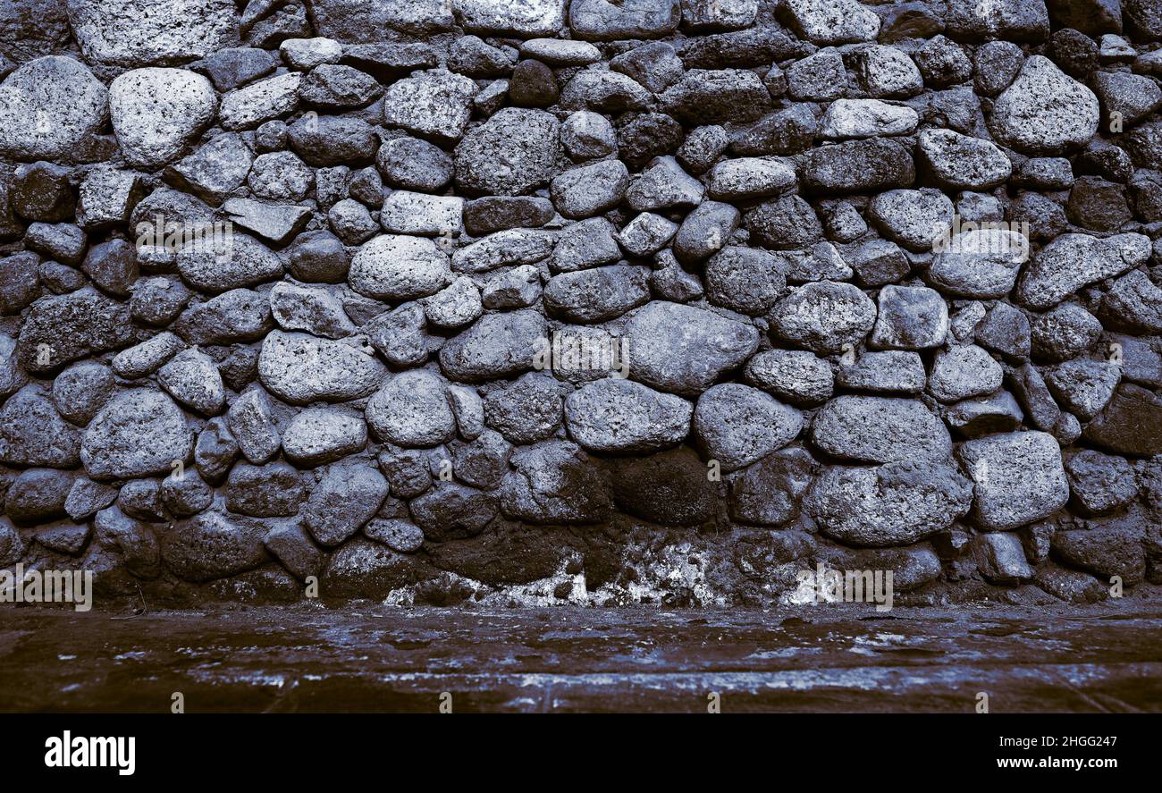 Alte Steinmauer, strukturierter Hintergrund mit Platz für Ihre Einfügung. Stockfoto