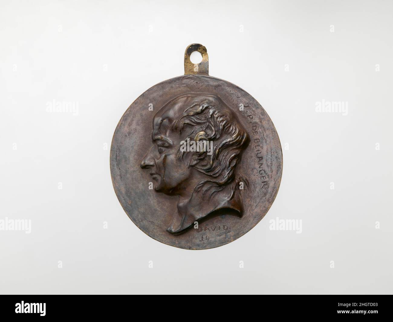 Pierre-Jean de Béranger (1780–1857) modelliert 1830, Abguss ca. 1830–56 Medaillengewinnerin: Pierre Jean David d'Angers Französisch Pierre-Jean David d'Angers war der produktivste und einer der wichtigsten französischen Bildhauer der ersten Hälfte des 19. Jahrhunderts. Während seiner fast fünfzigjährigen Karriere (1819–1856) blieb David seiner Überzeugung treu, dass skulpturale Denkmäler, die den Leistungen großer Männer und Frauen gewidmet sind, die Größe eines Volkes am dauerhaftesten und lebhaftesten zum Ausdruck bringen. Er suchte kontinuierlich Aufträge für Denkmäler, die historische und zeitgenössische Figuren darstellen, die er bewunderte Stockfoto