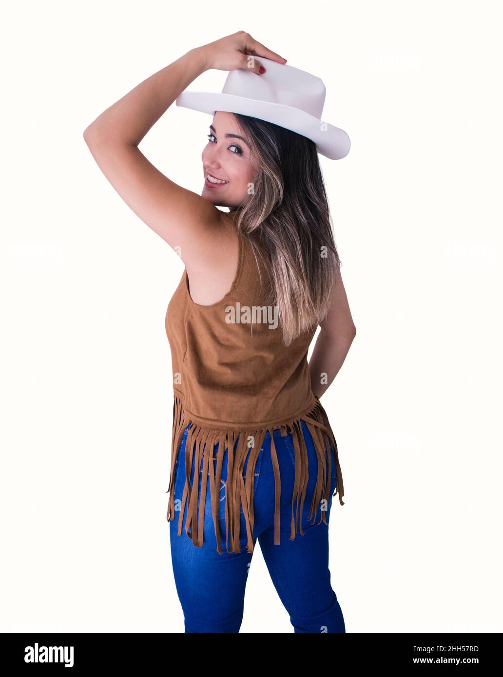 Cowgirl brünette junge Frau isoliert in weißem Hintergrund. Konzept im Landhausstil. Stockfoto