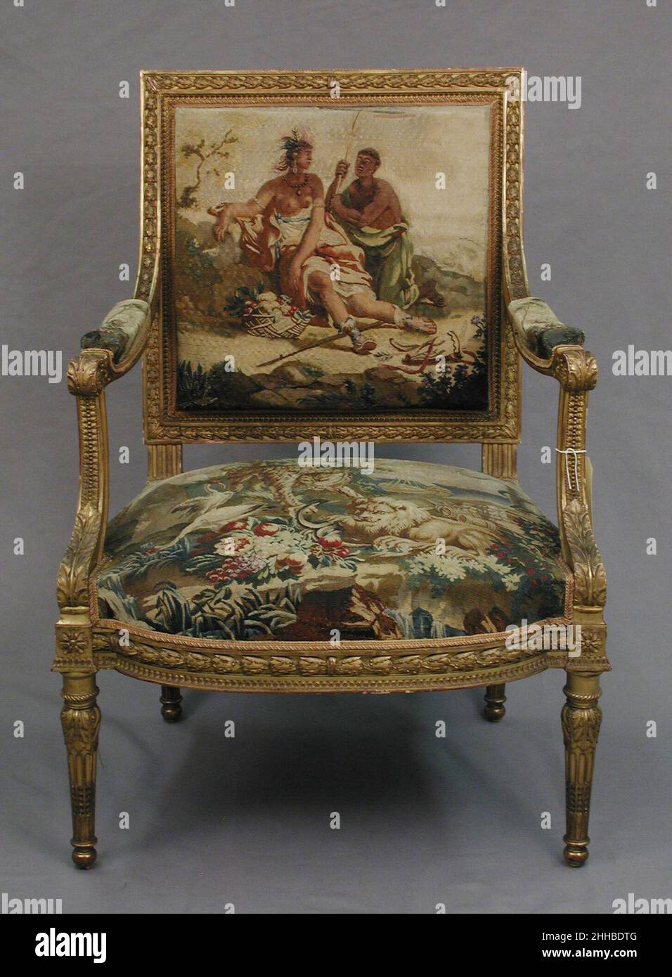 Sessel gestaltet ca. 1786, gewebt 1790–91; Stuhlgestell zweite Hälfte 19th Jahrhundert Tapisserie von Beauvais Dieses Ensemble gehört im Auftrag von Louis XVI. Zu einem Satz von vier Wandbehängen (1978.404.1–.4) und 56 Möbelpolstern (1978.404.5a–c–.18a–c), die die vier Kontinente darstellen: Amerika, Europa, Asien und Afrika. Sessel 231936 Stockfoto