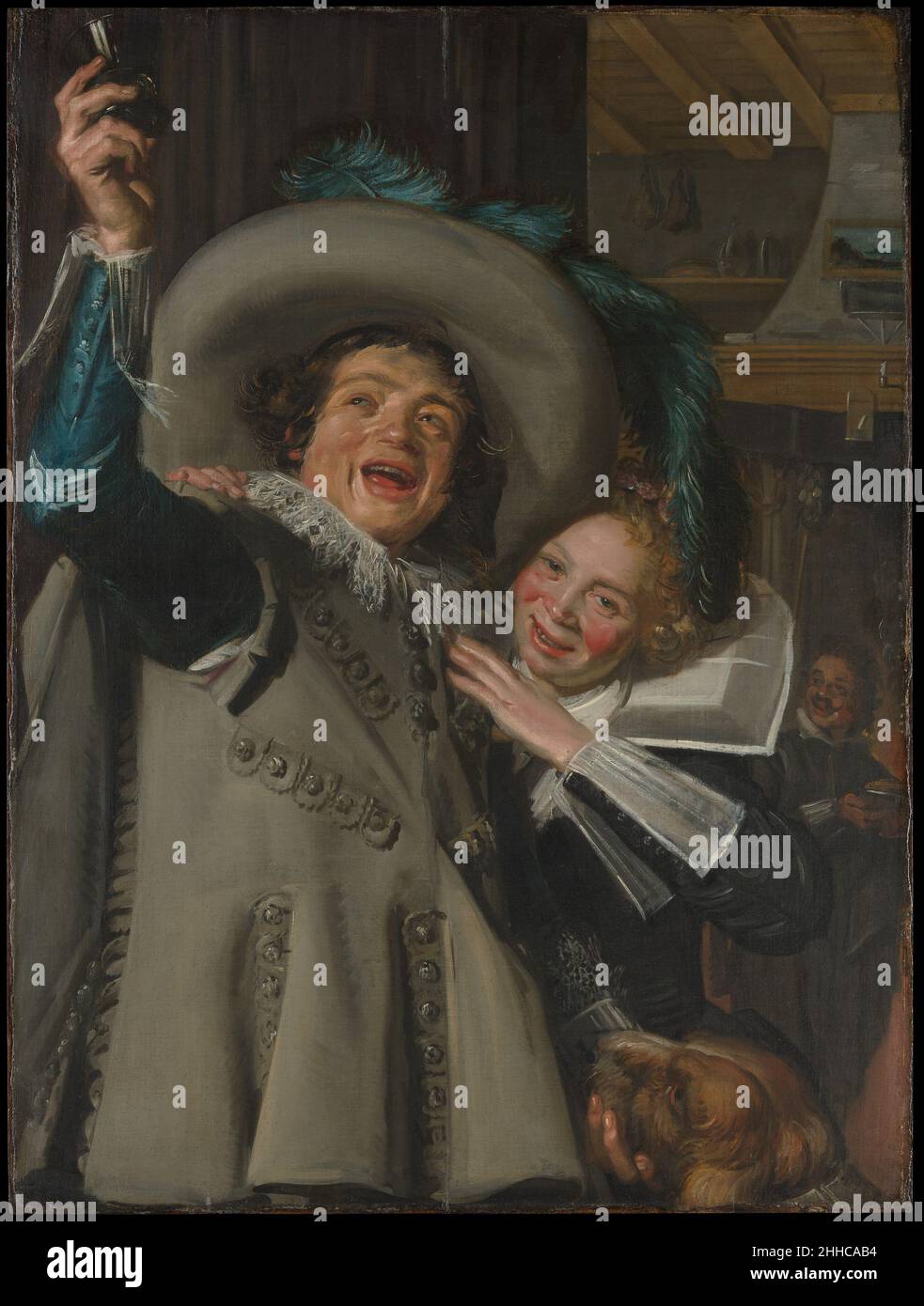 Young man and Woman in an Inn 1623 Frans Hals Dutch Dieses Bild, gemalt mit dem charakteristisch kühnen Pinselstrich, den Hals in der flämischen Malerei gelernt hatte, bietet eine glanzlose, nicht wertende Darstellung eines jungen Paares, das in der Tür eines Gasthauses oder Bordells streichelt. Gespülte Wangen und ein offenes Grinsen deuten darauf hin, dass das Paar gegen die zeitgenössischen Regeln der Komportierung verstoßen hat. Doch selbst das bescheidene Innere, in dem sie sich befinden, zeigt ein Landschaftsgemälde über dem Kaminsims. Hören Sie zu, wie Experten die Geschichte dieses Kunstwerks beleuchten Hörspiel oder Pause #5032. Junger Mann und Frau in einem Stockfoto