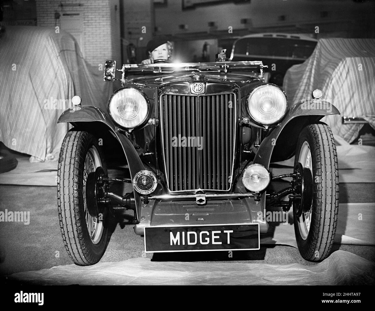 Die British International Motor Show fand vom 14th. Bis 23rd. Oktober 1937 in Earls Court, London, statt. MG Midget bei der Show, eines der beliebtesten Autos Großbritanniens. 12th. Oktober 1937. Stockfoto