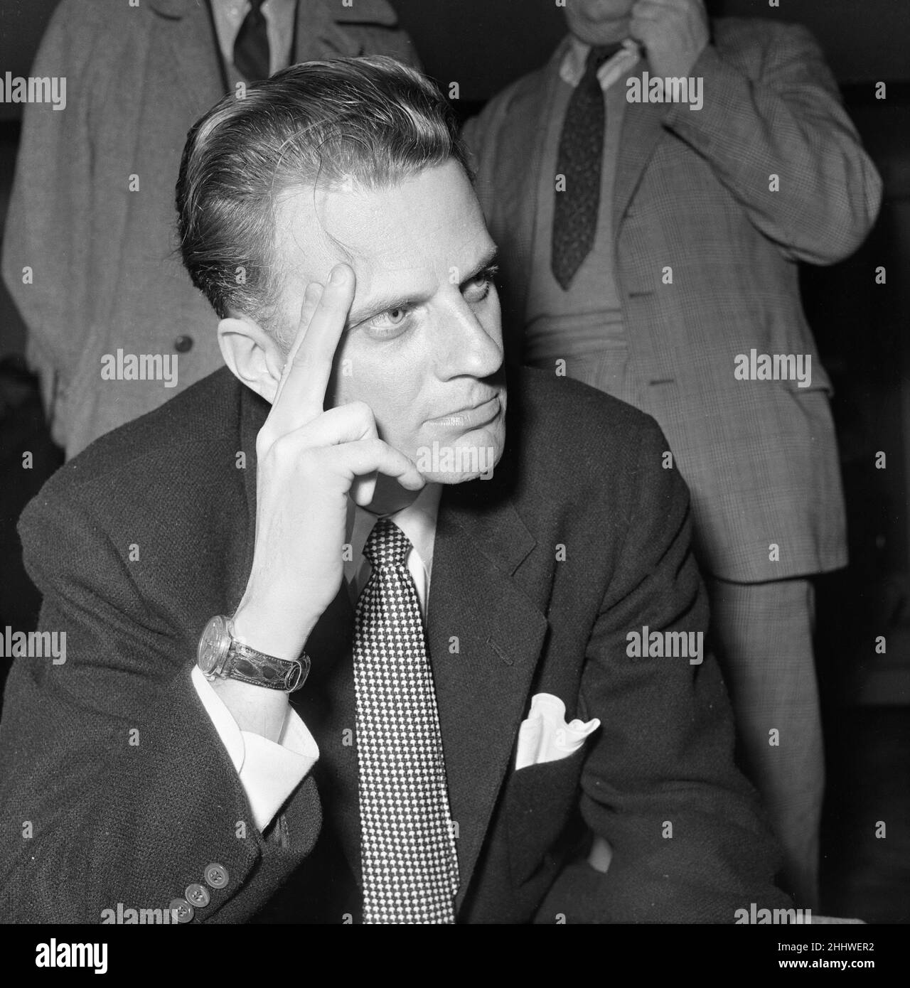 Billy Graham, der amerikanische Evangelist, stellte sich bei seiner Ankunft in Southampton vor, um seinen dreimonatigen Kreuzzug in London zu beginnen. 23rd. Februar 1954. Stockfoto