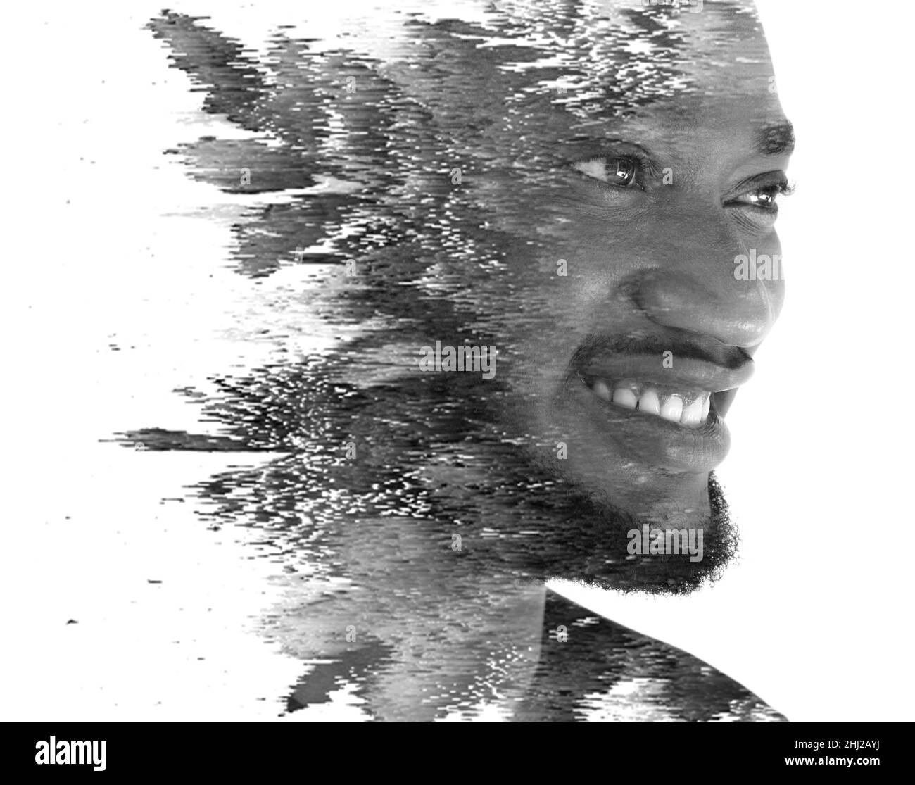 Ein Doppelbelichtungs-Porträt eines Mannes kombiniert mit digitaler Kunst Stockfoto