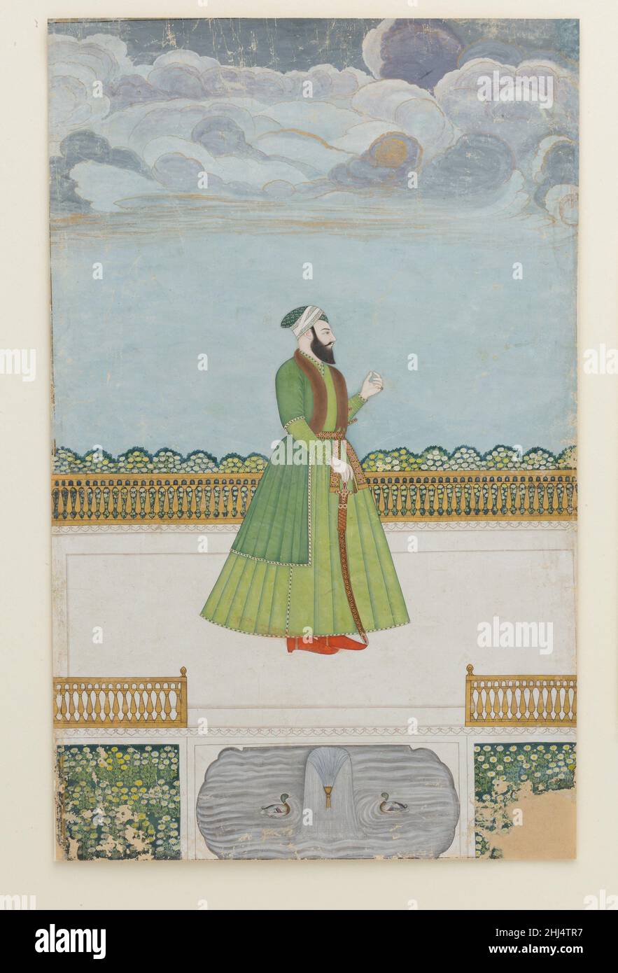 Edelmann auf einer Terrasse ca. 1780 die Ersatzeinstellung, begrenzte Palette und figürlichen Stil weisen dieses Gemälde dem späten Mughal Zentrum von Murshidabad zu. Das Porträt kann mir Jafar Khan, Nawab von Bengalen, darstellen, der Shuja' al-Daula bei der Schlacht von Plassey im Jahr 1757 verleugnen und von den Briten mit dem Thron von Bengalen belohnt wurde. Später missfiel er seinen Herren in Kalkutta und wurde zugunsten seines Schwiegersohns mir Qasim entthront, um später, in einer weiteren Glückswende, wieder eingesetzt zu werden. Adliger auf einer Terrasse. Ca. 1780. Tinte, opakes Aquarell, Silber und Gold auf Papier. Zugeschl Stockfoto