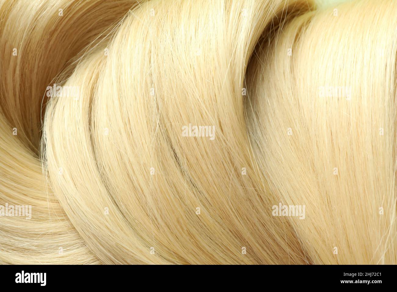 Blonde weibliche Haare auf dem ganzen Hintergrund, Nahaufnahme Stockfoto