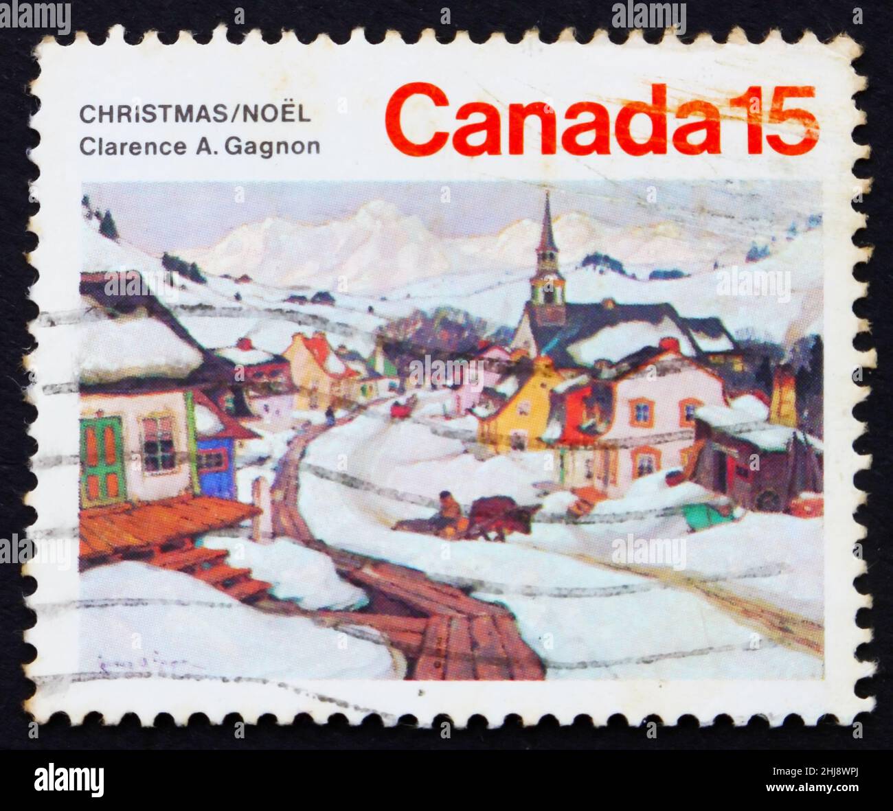 KANADA - UM 1974: Eine in Kanada gedruckte Marke zeigt das Dorf in den Laurentian-Bergen, Gemälde von Clarence A. Gagnon, Weihnachten, um 1974 Stockfoto