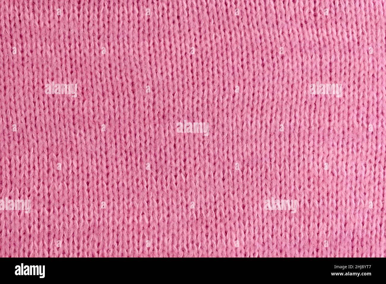 Weiches rosa gestricktes strukturiertes Stoffhintergrundmockup, Kopierbereich Stockfoto