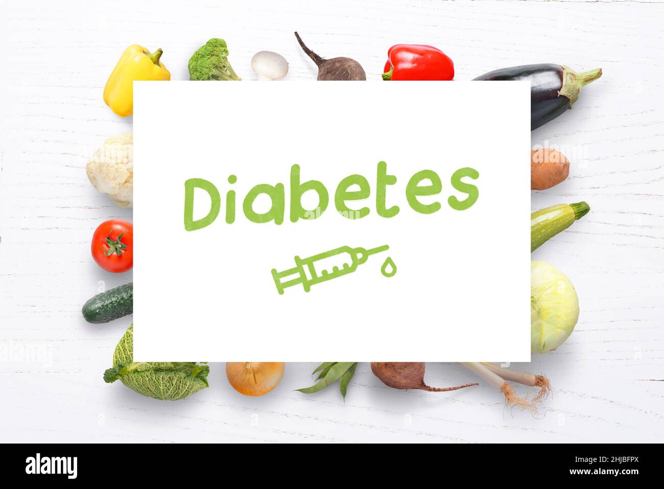 Diabetes-Konzept mit Diät und gesunder Ernährung am Schreibtisch. Insulininspritze auf Papier zeichnen. Konzept des Welt-Diabetes-Tages Stockfoto