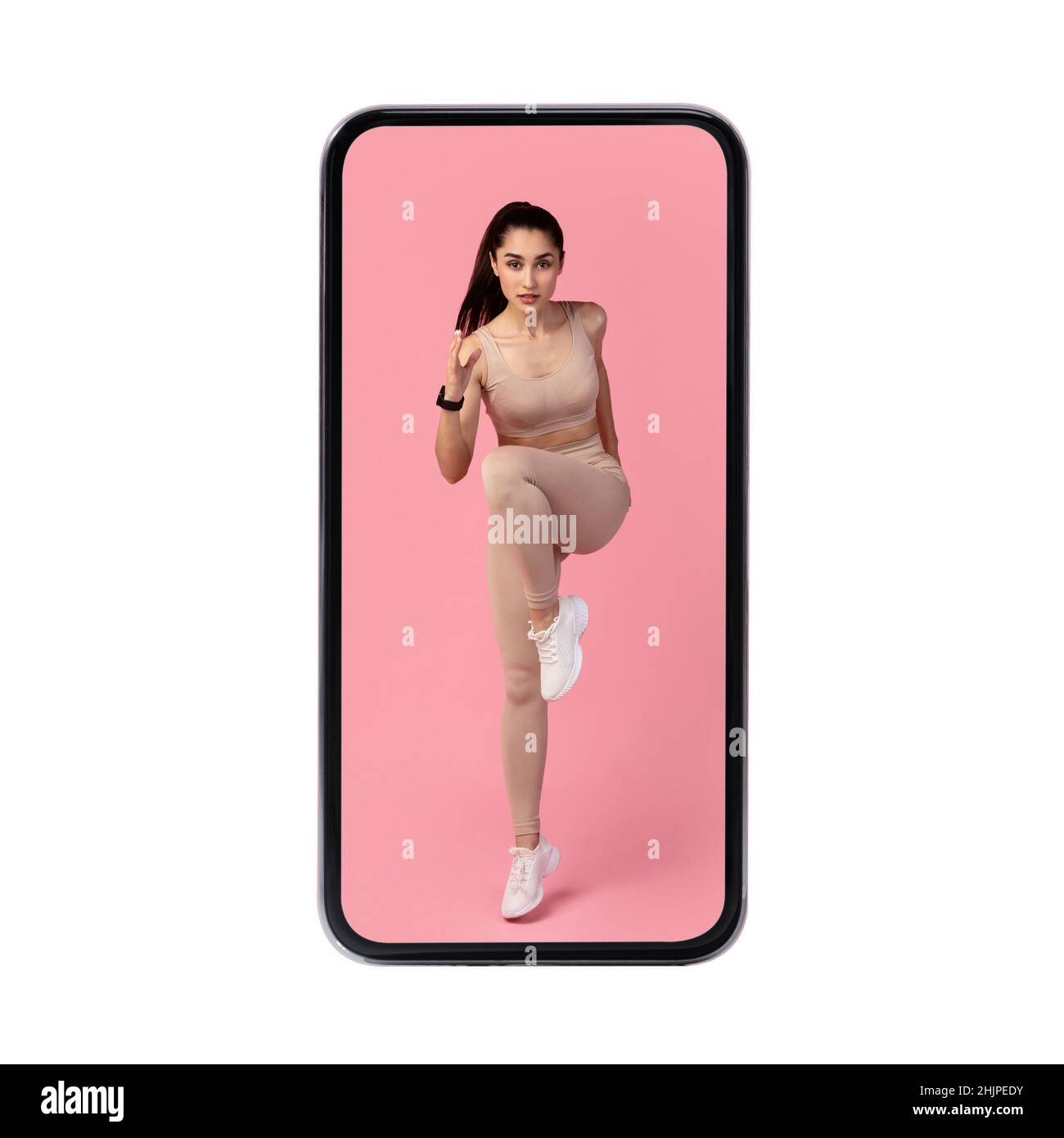 Großes Smartphone Mit Fit Frau Ausübung Auf Dem Bildschirm, Weißer Hintergrund Stockfoto
