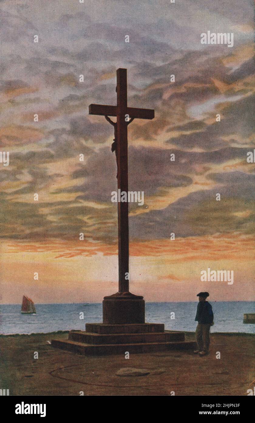 Überall im Land der Begnadigung drücken Symbole wie dieses feine Kruzifix neben der Concarneau Bay die Seele eines religiösen Volkes aus. Finistère. Bretagne (1923) Stockfoto