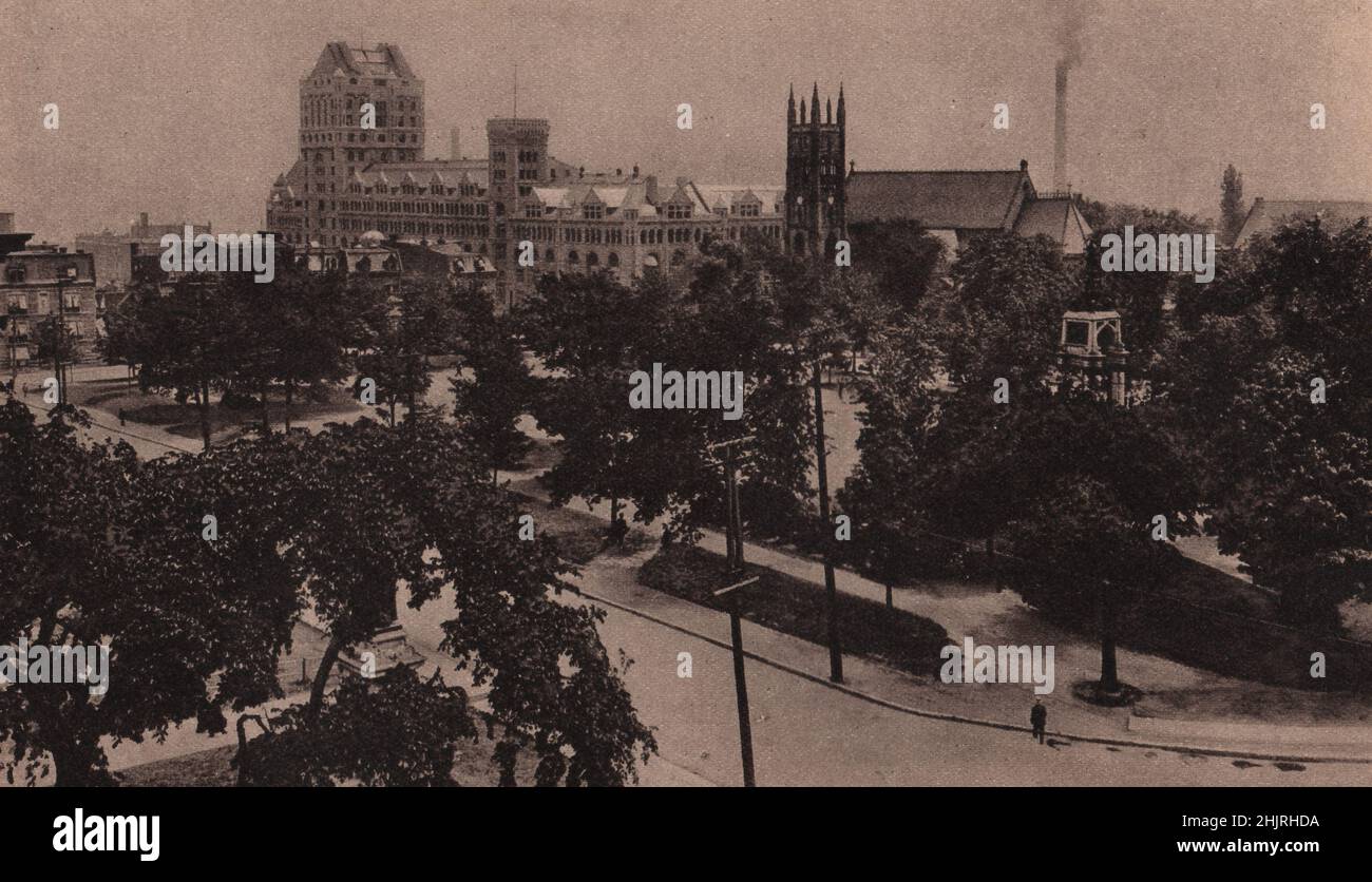 Direkt unterhalb des Dominion Square befindet sich die Windsor Street Station, die größte Bahnhaltestelle in Kanada. Auf der rechten Seite ist die St. George's Church. Montreal (1923) Stockfoto