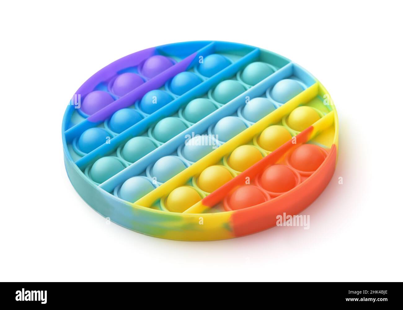 Runde Regenbogen Pop es Fidget Spielzeug isoliert auf weiß Stockfoto
