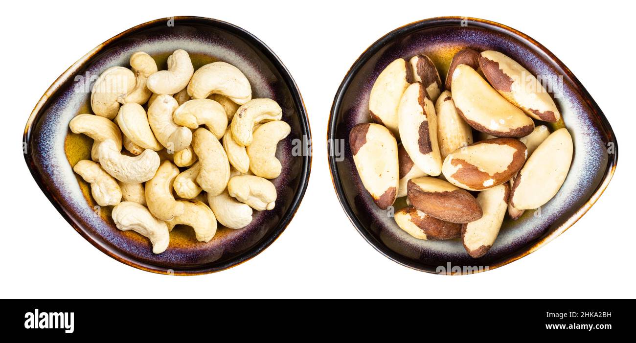 Set aus paranüssen und Cashew in Keramikschalen isoliert auf weißem Hintergrund Stockfoto