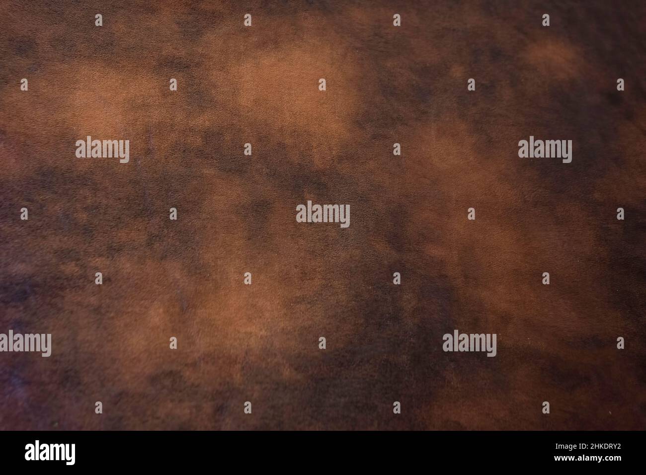 Hintergrund aus Kunstleder in verschiedenen Brauntönen. Stockfoto