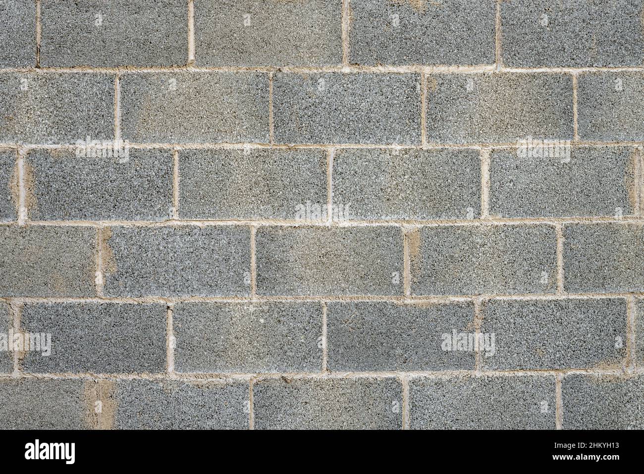 Hintergrund von einer grauen Wand aus Porenbetonsteinen Stockfoto