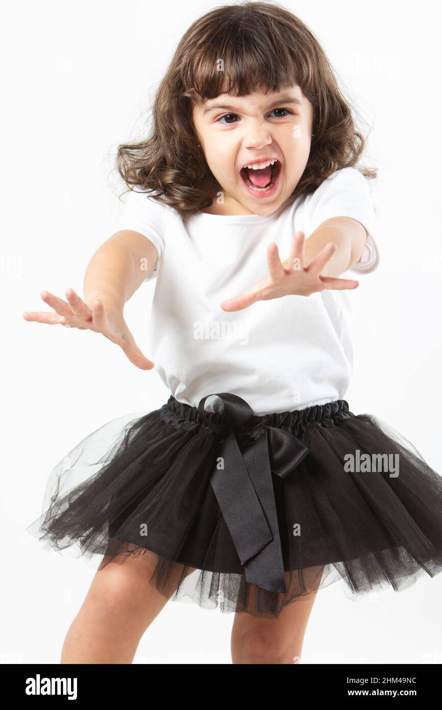 Brunette Mädchen mit schreienden Ausdruck und Ballerina Tutu auf weißem Hintergrund Stockfoto