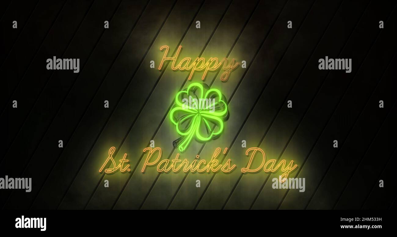Bild der Worte Happy st patricks Day in neon flackernden gelben Buchstaben geschrieben Stockfoto