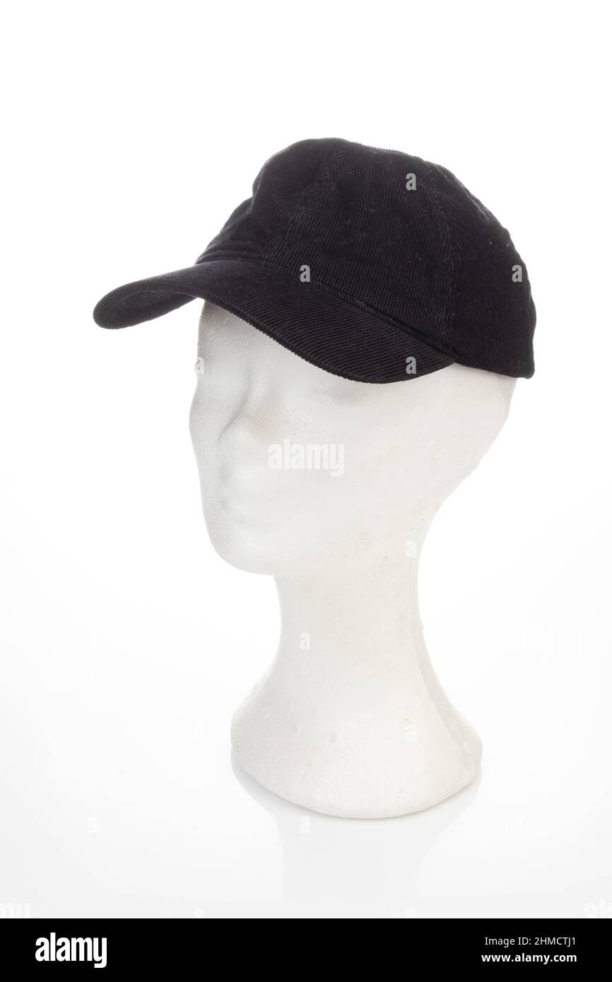 Schaufensterpuppe Kopf trägt dunkelblauen Cord Jockey Hut isoliert auf weißem Hintergrund, Seitenkopf Stockfoto
