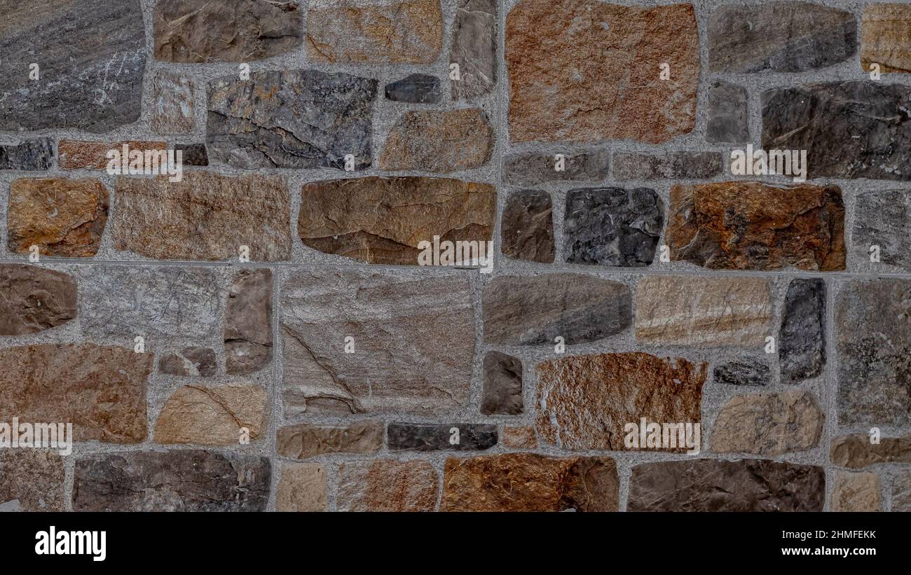 Rustikaler und gealterter Wandstein, Außenwand Stockfoto