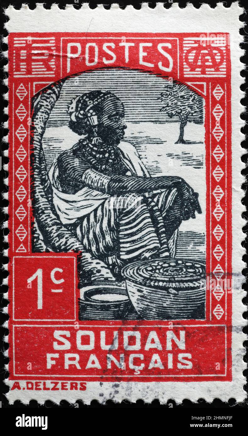 Sudanesische Frau auf Vintage-Briefmarke Stockfoto