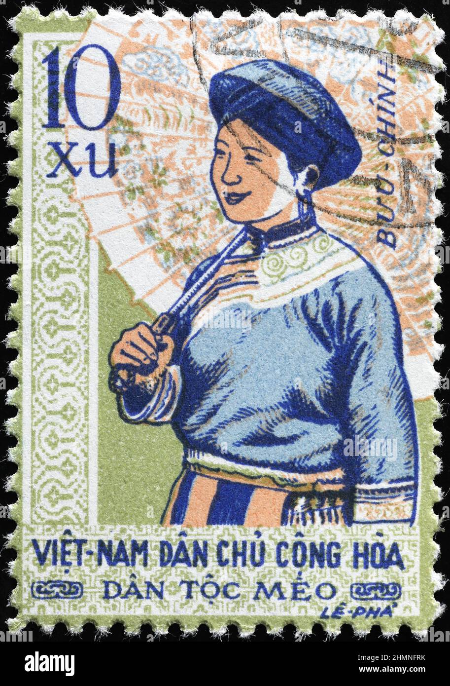 Vietnamesische Frau mit Regenschirm auf Briefmarke Stockfoto