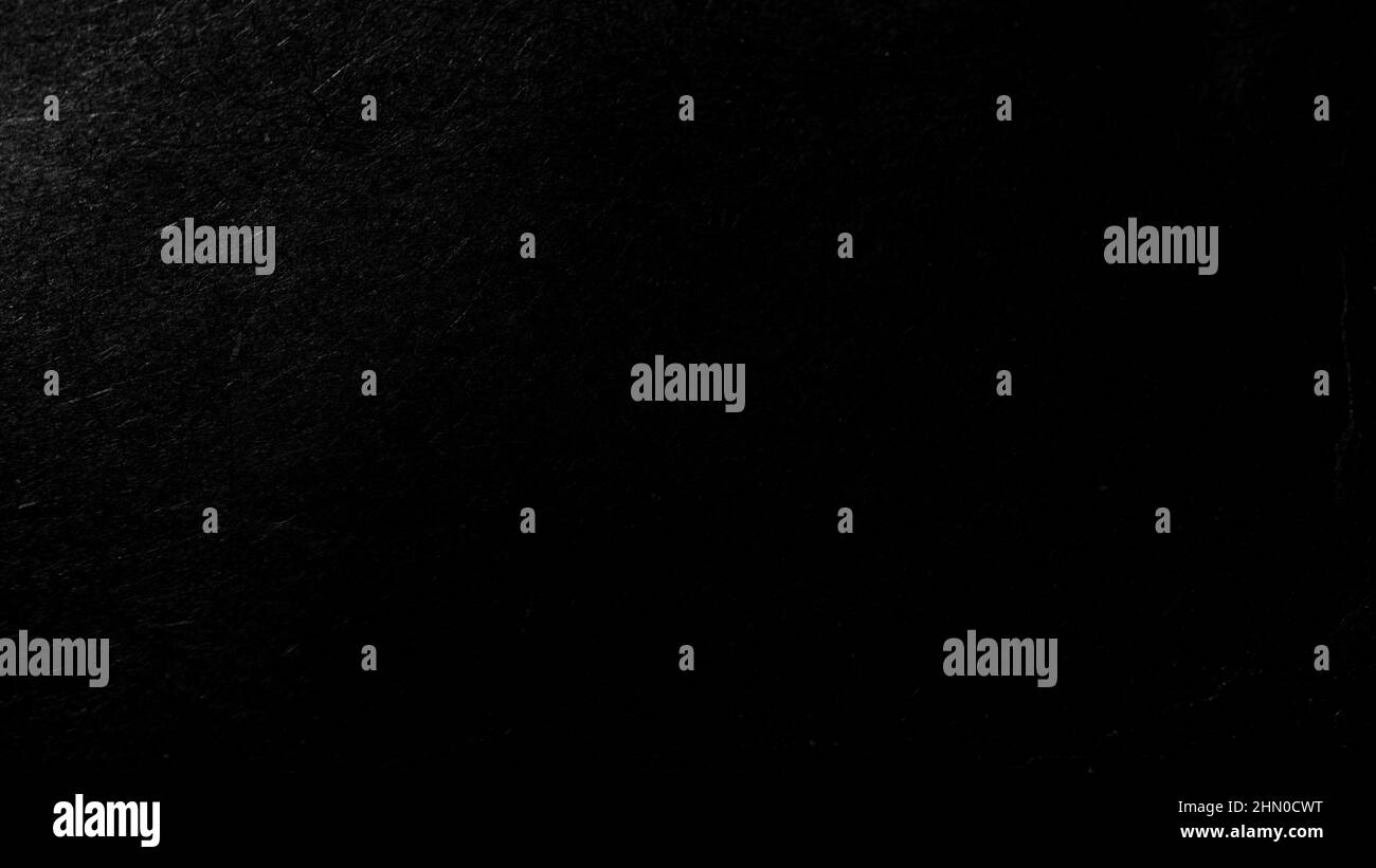 Dunkler abstrakter monochromer Hintergrund mit strukturiertem Effekt. Stockfoto