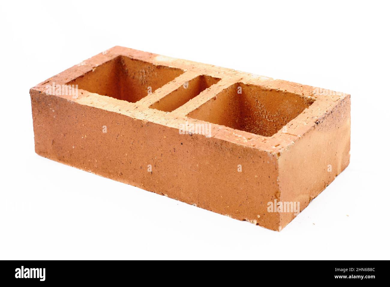 Produktfotografie aus orangefarbenem Ziegelstein, weißer Hintergrund Stockfoto