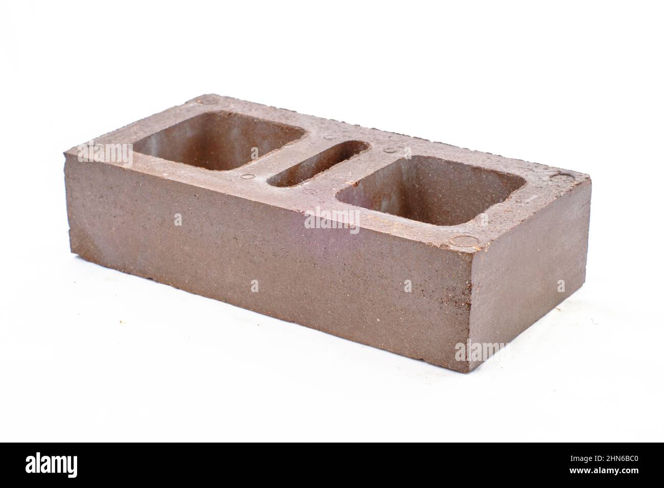 Produktfotografie aus grauem Ziegelstein, weißer Hintergrund Stockfoto