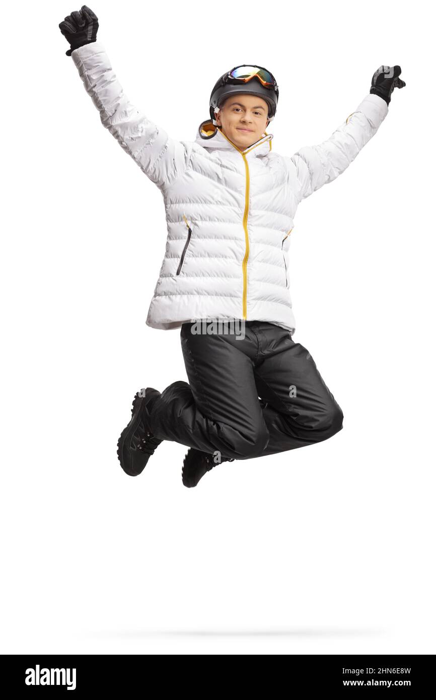 Glücklicher junger Mann in Winterkleidung springen isoliert auf weißem Hintergrund Stockfoto