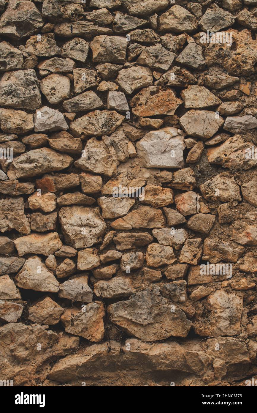 Alte steinmauer im mediterranen Stil des Hauses als Hintergrund Stockfoto