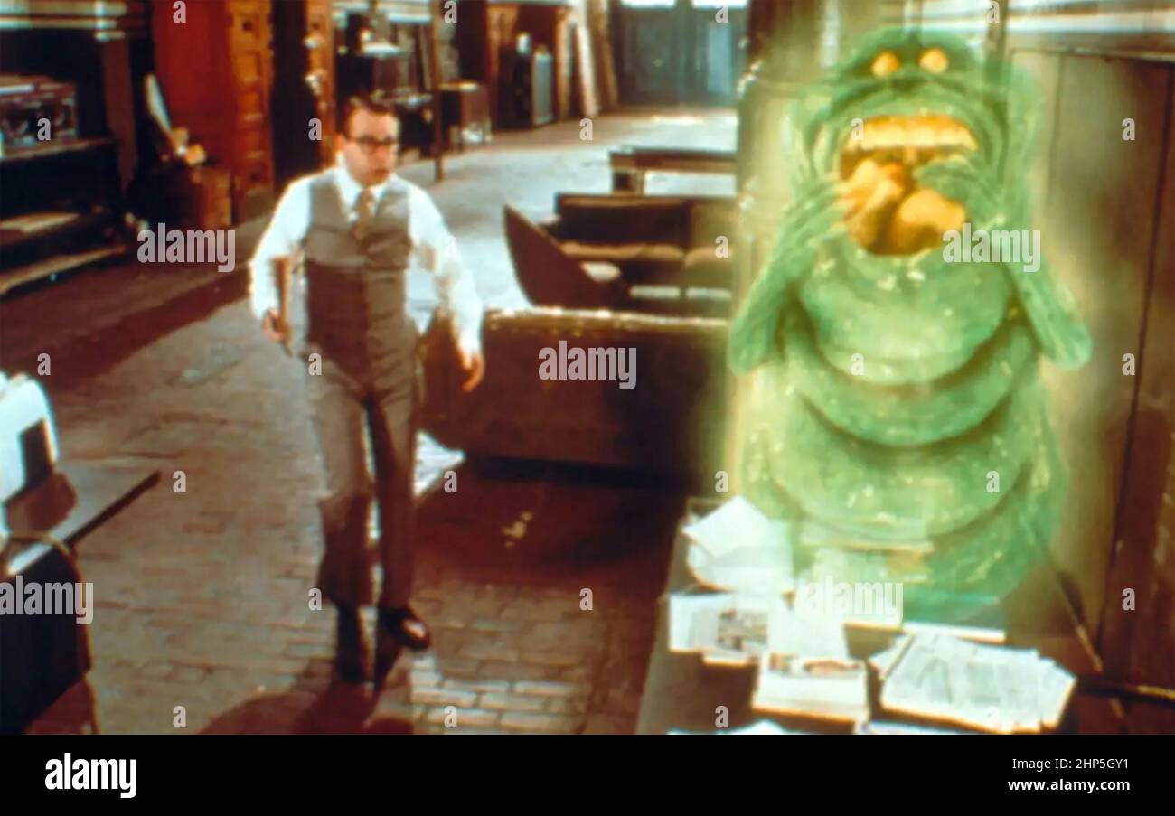 GHOSTBUSTERS 1984 Columbia Pictures Film mit Rick Moranis und dem Geist Slimer, geäussert b von Ivan Reitman Stockfoto