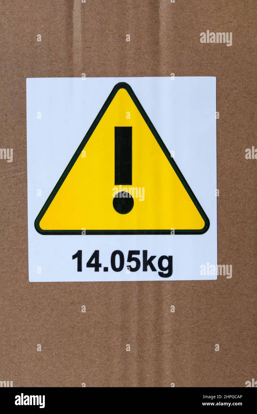 Ausrufezeichen mit 14,05kg Aufkleberetiketten auf Karton Stockfoto