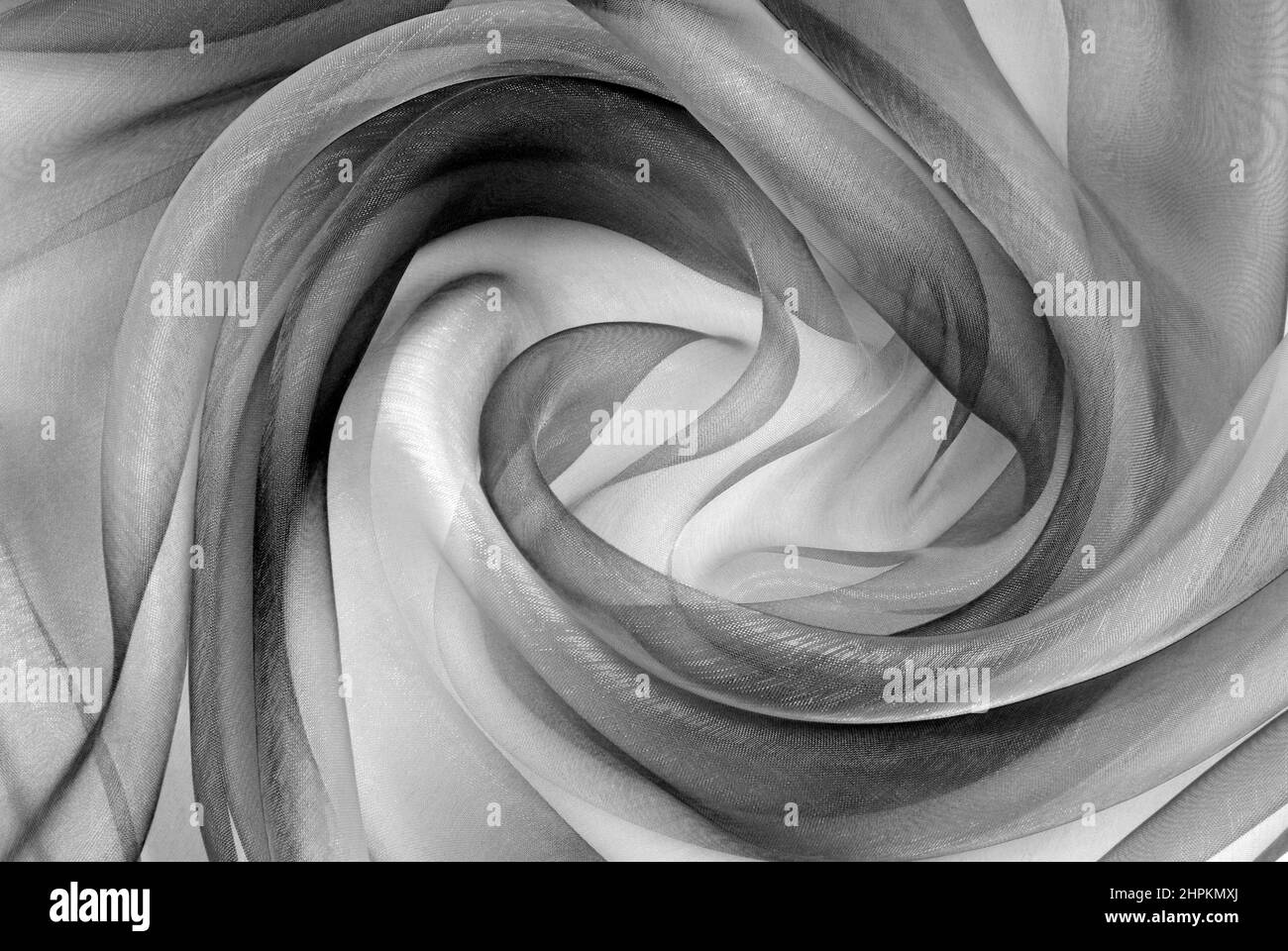 Twisted twirl von organza Stoff grau Textur Stockfoto