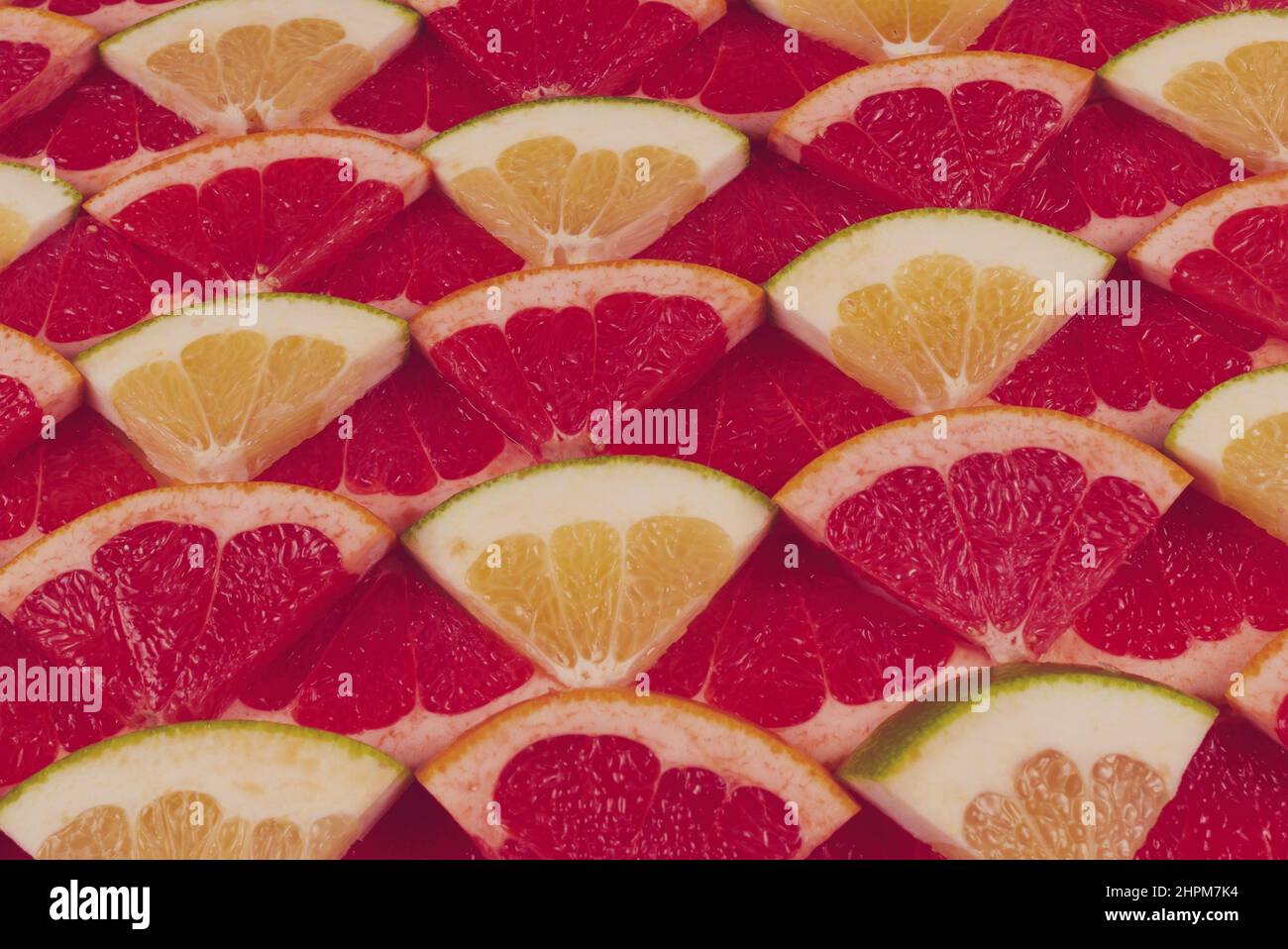 Pomelo und Grapefruit saftige Scheiben Hintergrund. Stockfoto