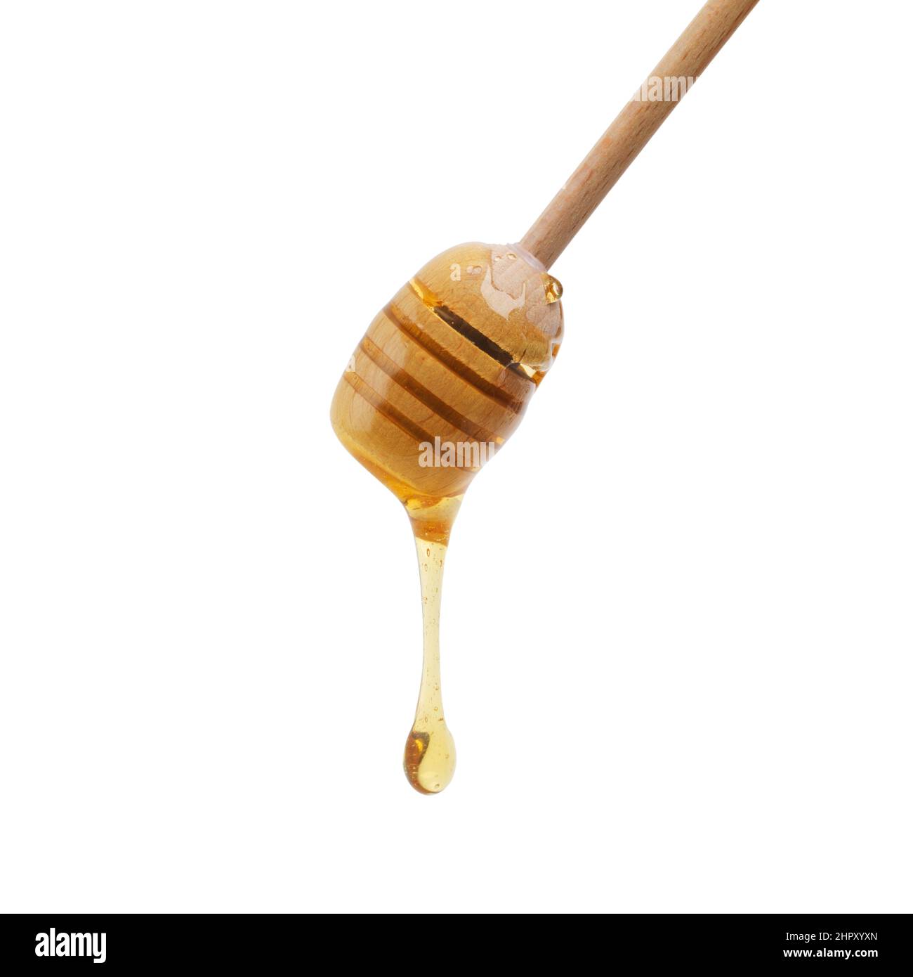 Mit Bienensaft beträufend. Schuss eines Honigtauchers, der köstlichen Honig tropft. Stockfoto
