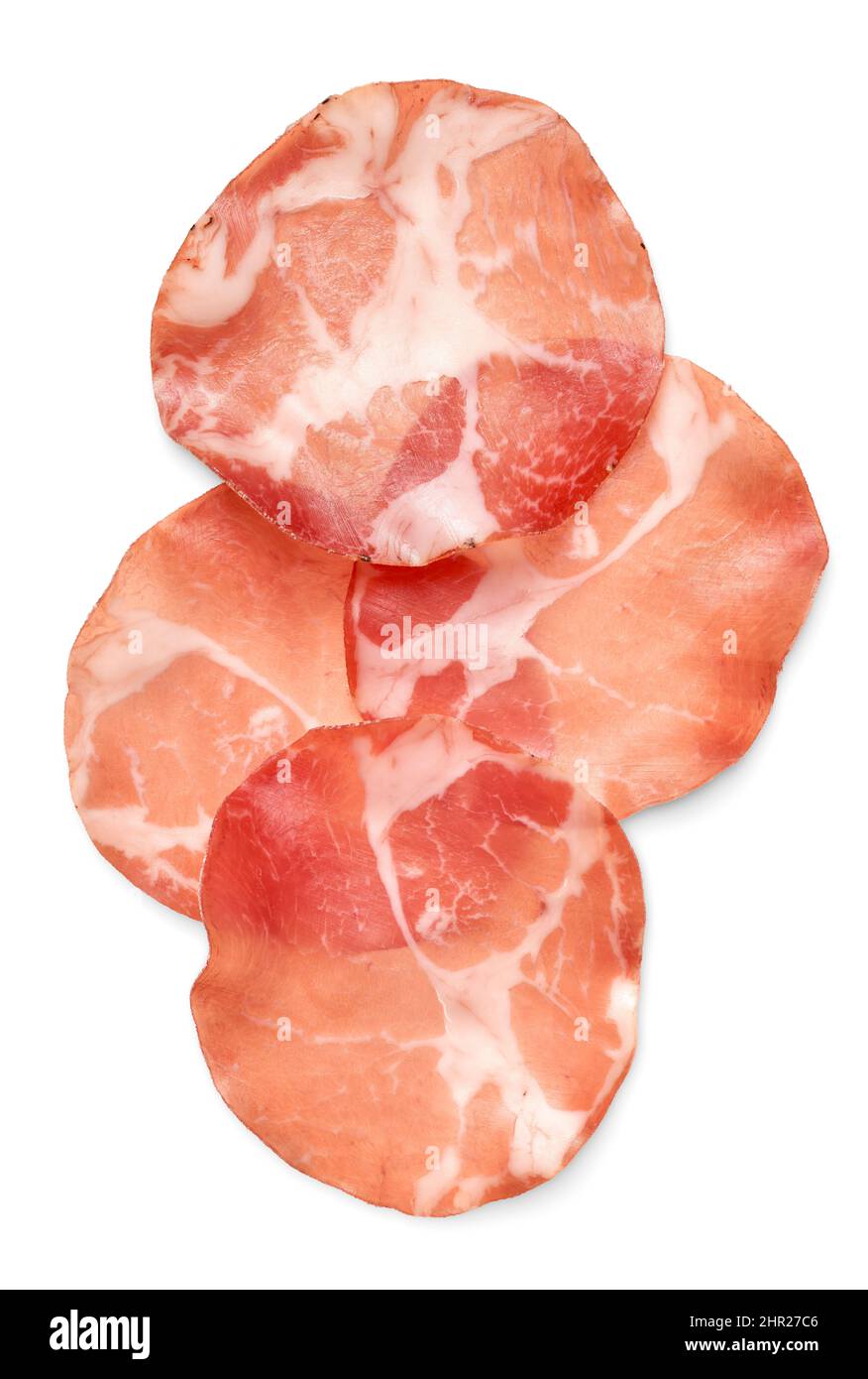 Essen und Trinken: Dünne Scheiben ausgehärtetes Schweinefleisch, isoliert auf weißem Hintergrund Stockfoto