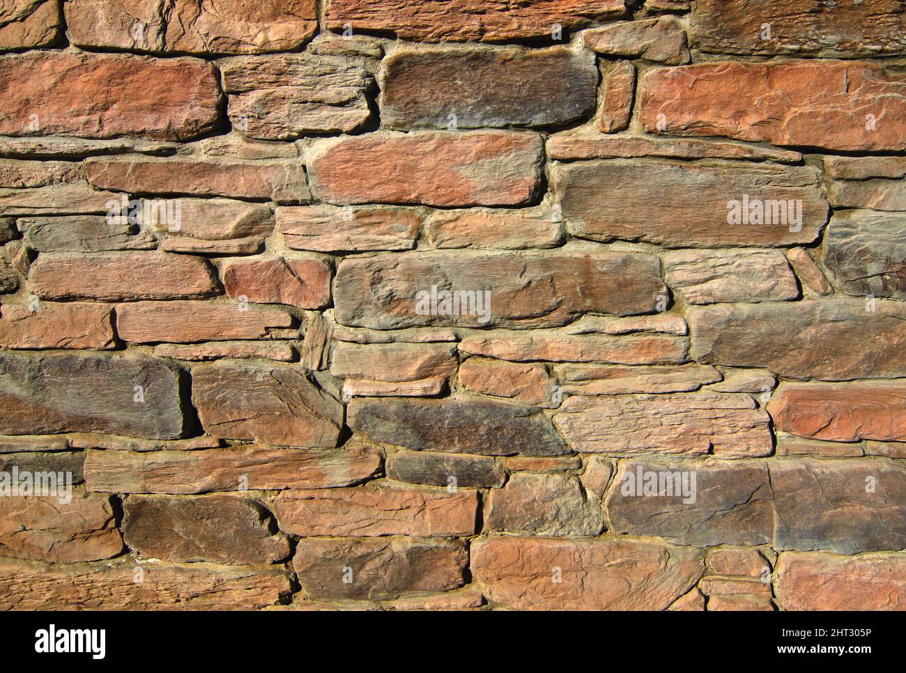 Der Hintergrund alte beige steinige Wand. Stockfoto