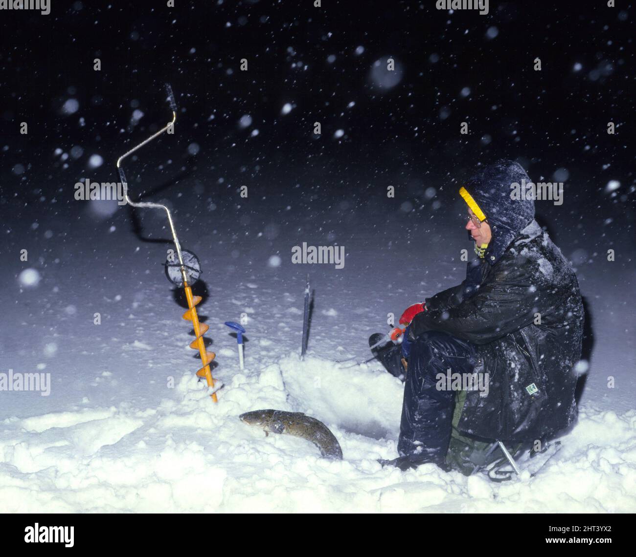 Pickel-Fischen im Schnee Stockfoto