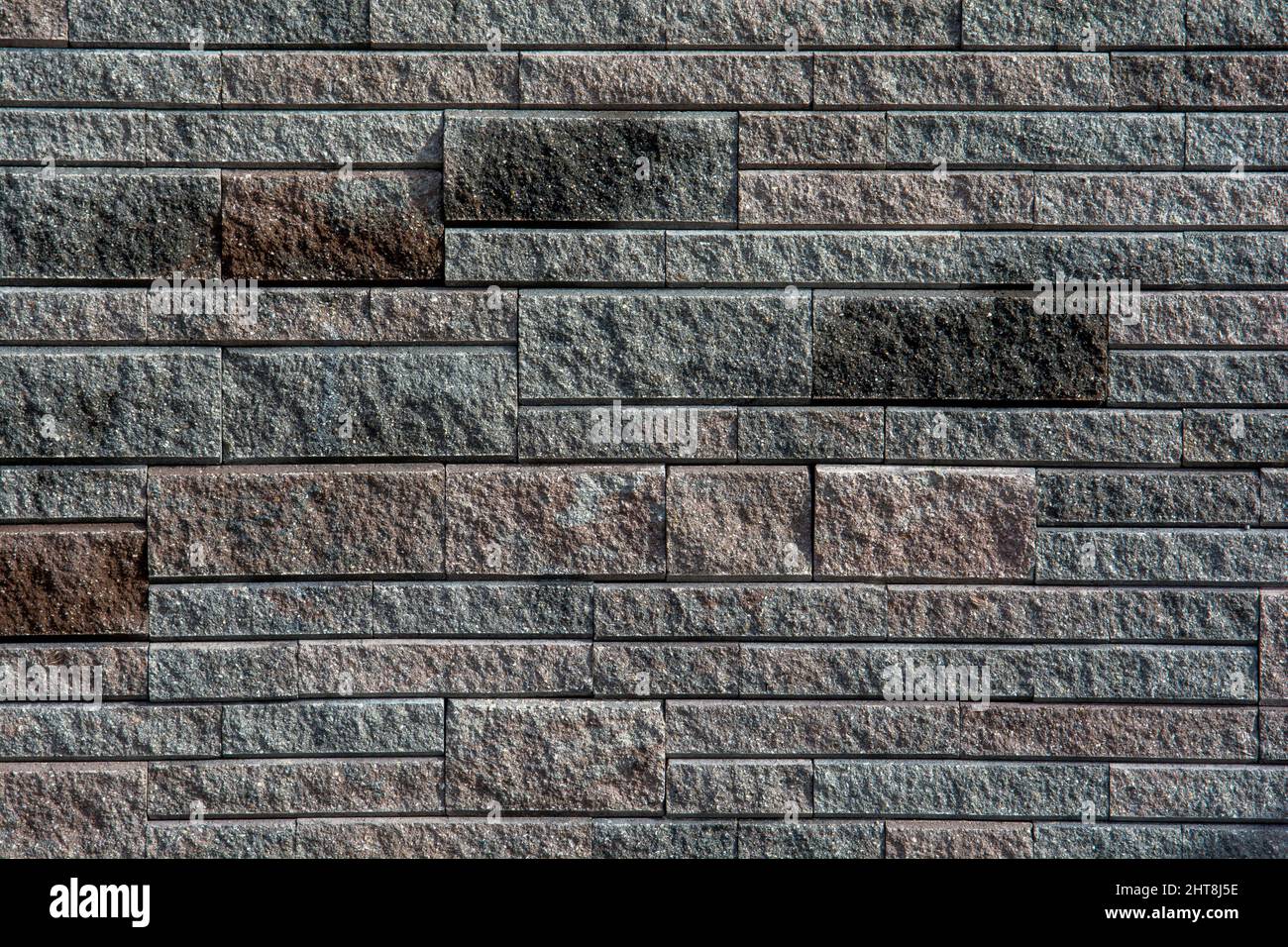 Wandstruktur aus Naturstein. Hintergrund. Zusammenfassung. Oberfläche. Stockfoto