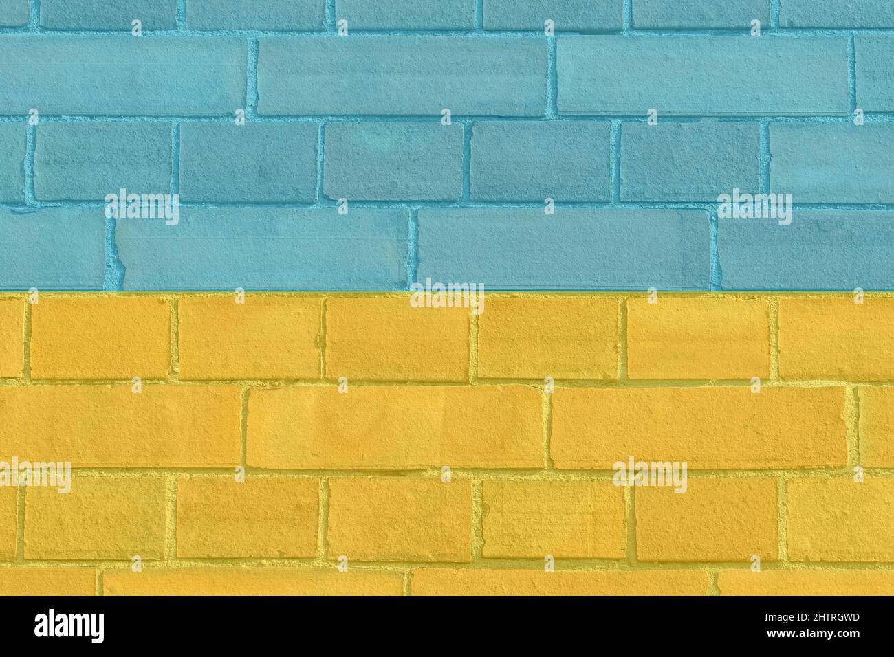 Ziegelwand in gelben und blauen Farben Stockfoto
