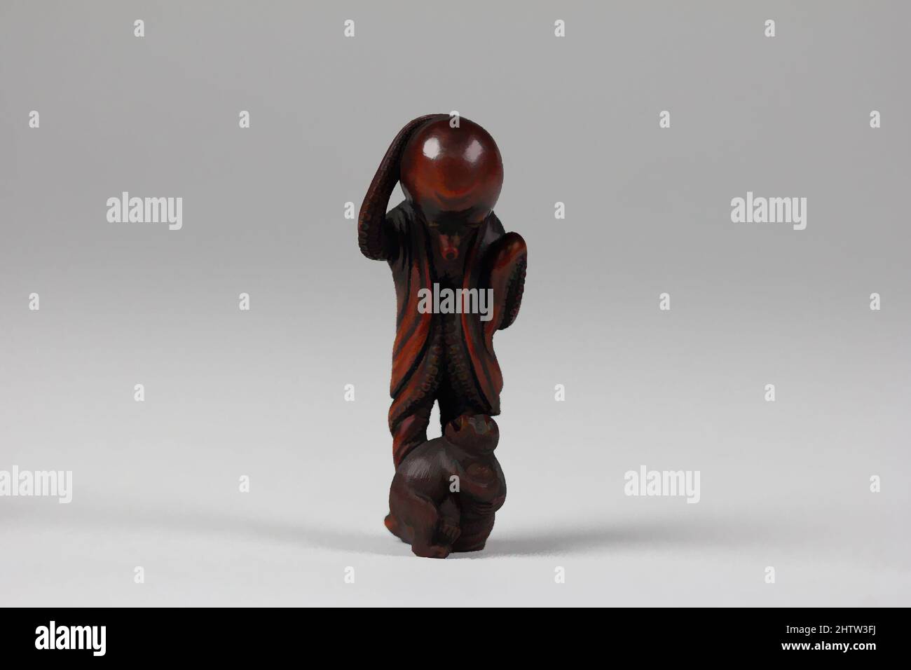 Art inspired by Netsuke of Octopus and Monkey, 19. Century, Japan, Wood, H. 1 3/4 in. (4,4 cm); B: 1 3/8 Zoll (3,5 cm), Netsuke, Classic Works modernisiert von Artotop mit einem Schuss Moderne. Formen, Farbe und Wert, auffällige visuelle Wirkung auf Kunst. Emotionen durch Freiheit von Kunstwerken auf zeitgemäße Weise. Eine zeitlose Botschaft, die eine wild kreative neue Richtung verfolgt. Künstler, die sich dem digitalen Medium zuwenden und die Artotop NFT erschaffen Stockfoto