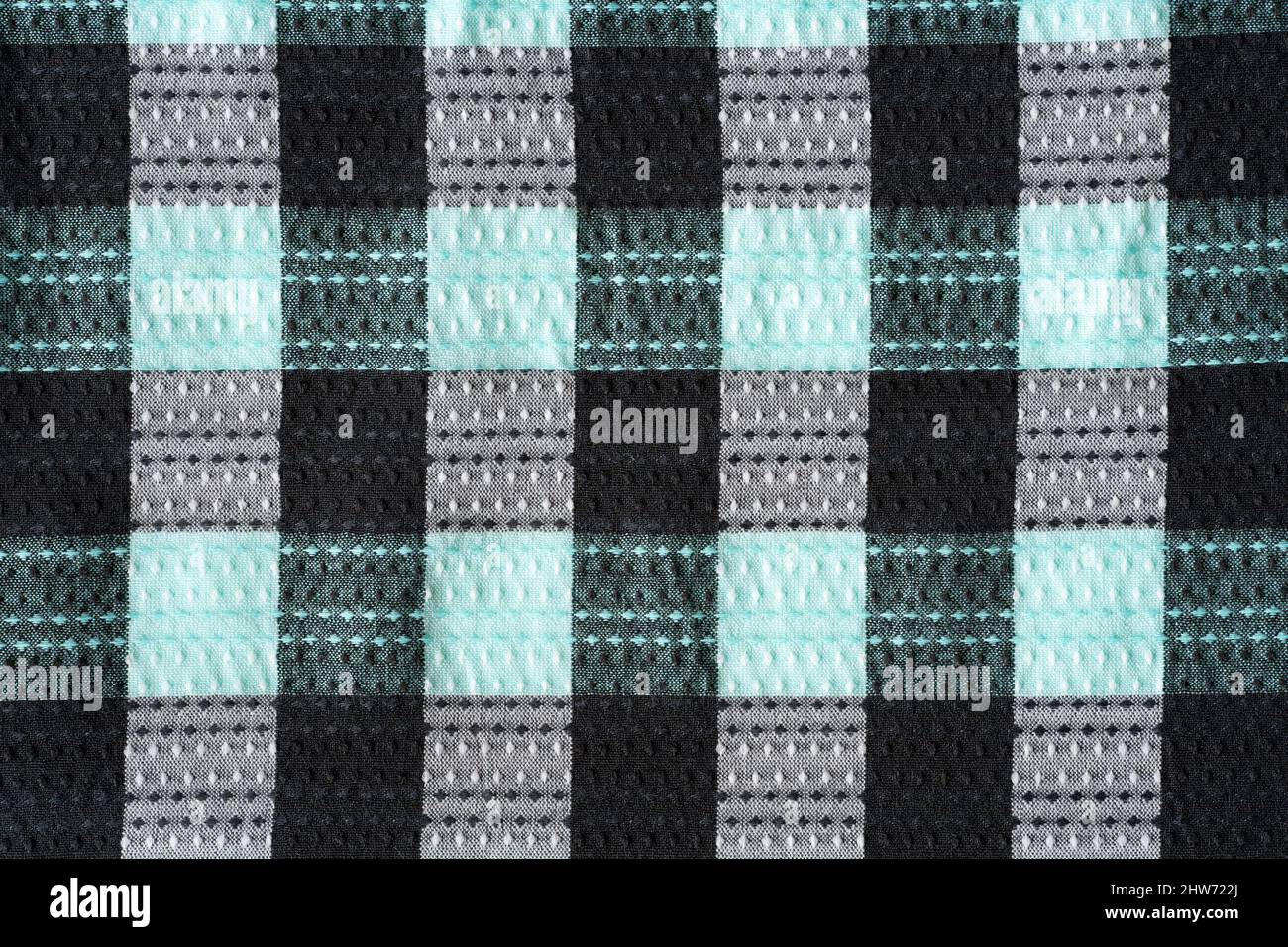 Schwarz grau und mintgrün Schachbrettmuster textiler Hintergrund Stockfoto